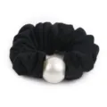 Elegant black wool scrunchie detail featuring a large pearl decoration for chic hairstyles. - Black