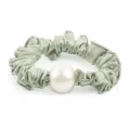 Satin pearl scrunchie detail close-up, elegant green pleated hair tie for women ponytail holder. - Green