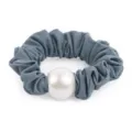 Grey textured fabric hair scrunchie detail shot featuring a large central white pearl accent. - Haze Blue