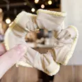 Elegant beige velvet hair scrunchie with yellow plush border for cute ponytail styling. - Nude
