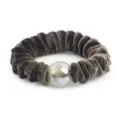 Close-up of a dark brown velvet scrunchie featuring a shiny glitter bead for elegant hair styling. - Gray