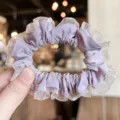 Elegant purple hair scrunchie with delicate mesh ruffle edge, soft pleated design for women. - Purple