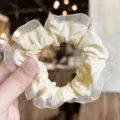 Yellow ruffled scrunchie with sheer mesh lace border, soft hair tie detail accessory. - Beige