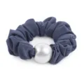 Detailed close-up of a dark grey scrunchie featuring a large smooth pearl ornament. - Blue and Purple