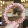Pink satin hair scrunchie detail view, featuring a chic square accent and high elasticity. - Deep Pink