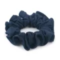 Close-up detail of a dark blue velvet scrunchie showing fine fabric texture and neat pleats. - Dark Blue