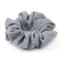 Close-up detail of a minimalist grey wool hair scrunchie showing soft textured fabric. - Light Gray