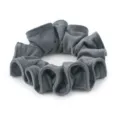 Close-up detail of dark grey velvet hair scrunchie, soft texture and pleated edge design. - Gray