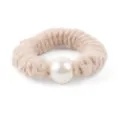 Close-up detail of a chic beige wool scrunchie with large faux pearl for elegant hairstyles. - Milk Nude