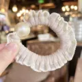 Elegant beige lace hair scrunchie with large artificial pearl chic bun maker fashion accessory - Nude