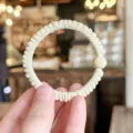 Minimalist pleated hair scrunchie with round bead detail, soft elastic fabric for daily wear. - S / Beige