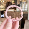 Detail view of pink pleated hair scrunchie with soft bead accessory for women - S / Pink