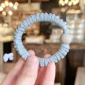 Soft pleated hair scrunchie with round bead detail, elegant elastic hair tie accessory. - L / Blue