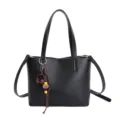 Black leather women tote shoulder crossbody bag detail with cute headphone pendant accessory. - With Pendant / Black