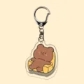 Close-up of clear acrylic cute cartoon bear keychain pendant, detailed view, stylish accessory. - A12-22