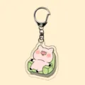 Cute acrylic keychain with a lovely cartoon pig sitting on a sofa, perfect backpack pendant. - A12-23