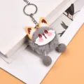 Cute grey plush animal keychain with fluffy pompoms, perfect bag charm and keyring accessory. - Gray