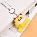 Cute yellow plush animal keychain with fluffy ball, resin face details and metal ring. - Yellow
