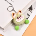 Green plush monster keychain pendant with cute face and fluffy pom poms for bags and keys - Green