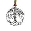 Detailed shot of vintage silver tree of life ornament, perfect for holiday tree hanging. - Tree of Life