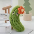 Cute green cucumber plush keychain with orange flower accessory, soft bag pendant toy. - Orange Floral / 13cm