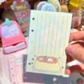Cute A7 binder notebook refill paper with adorable pudding illustration for daily planners. - Pudding