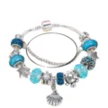 Ocean style charm bracelet with blue crystal beads, turtle, starfish, and seashell charms. - 17cm / Silver