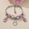 Bracciale con ciondoli in pietra occhio di gatto rosa, catena a serpente e fiori. - 16cm+5cm Estensione