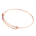 Dettaglio bracciale rigido in filo di acciaio inossidabile regolabile, metallo oro rosa. - Oro rosa