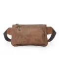 Brown chest bag detail showing matte leather texture, dual zippers, and durable adjustable strap. - Khaki