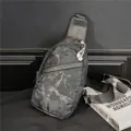 Close up view of stylish camouflage chest bag, trendy men sling bag with durable strap. - Camouflage