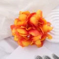 Vibrant orange artificial flower hair clip, perfect for Hawaiian beach and tropical summer vacations. - Orange Red
