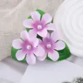 Kids faux flower hair clip with three pink flower pieces, green leaves and pearl for boho styles. - Light Purple