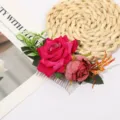 Close-up detail of the red fabric rose flower hair comb, showing delicate petal texture. - Rose Red