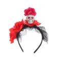 Detailed close-up of Halloween skull headband featuring red artificial roses and black lace. - Red