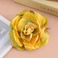 Vintage fabric yellow rose flower hair clip close-up shot, perfect for party photo props. - Yellow-Green