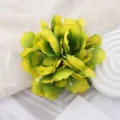 Detail view of artificial flower hair clip tropical style yellow green hair accessory women. - Yellow-Green