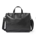 Black leather business briefcase detail shot, durable top handle and shoulder strap design. - Black