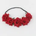 Close up view of red velvet rose flower elastic headband detail, perfect for parties. - Red
