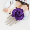 Halloween goth skeleton hand purple rose hair clip detail shot, unique spooky costume accessory. - Purple