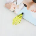 Close-up detail of neon yellow skeleton hand hair clip, gothic punk Halloween hair accessory. - Yellow