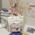 Γλυκό ροζ τσάντα itabag με αυτιά γάτας, διαφανή μπροστινή τσέπη και χαριτωμένα λούτρινα. - Ροζ τσάντα ώμου + μενταγιόν