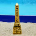 Ancient Egyptian obelisk miniature figurine close up detail, golden resin sand play toy decor. - Gold