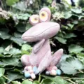 Resin quirky frog figurine detail shot, perfect garden decor ornament for outdoor and indoor use. - Pink Frog / Pink