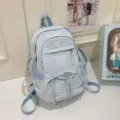 Light blue casual backpack for women, large capacity travel school bag with cute bow and embroidery. - Blue