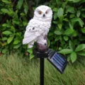 Gedetailleerd overzicht van witte uil solar tuinpaal lamp, waterdichte LED gazonlicht. - Wit