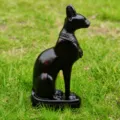 Close-up detail of the Egyptian cat god Bastet black resin figurine craft ornament. - Black