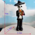 Halloween skeleton figurine wearing a sombrero and holding a drum, resin holiday decoration. - Drumming Skeleton