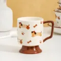 Close-up detail of ceramic high-footed mug with cute cartoon dog pattern and brown handle. - 401-500ml / Dachshund