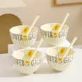 Cream style ceramic rice bowl set with spoons, embossed vertical stripes, yellow floral design. - 4 Bowls 4 Spoons